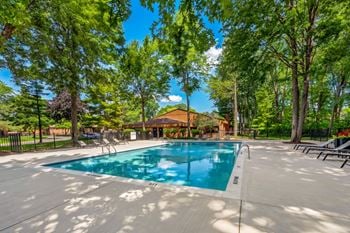 Heated swimming pool and sundeck at eastwood village apartments in clinton township, mi.